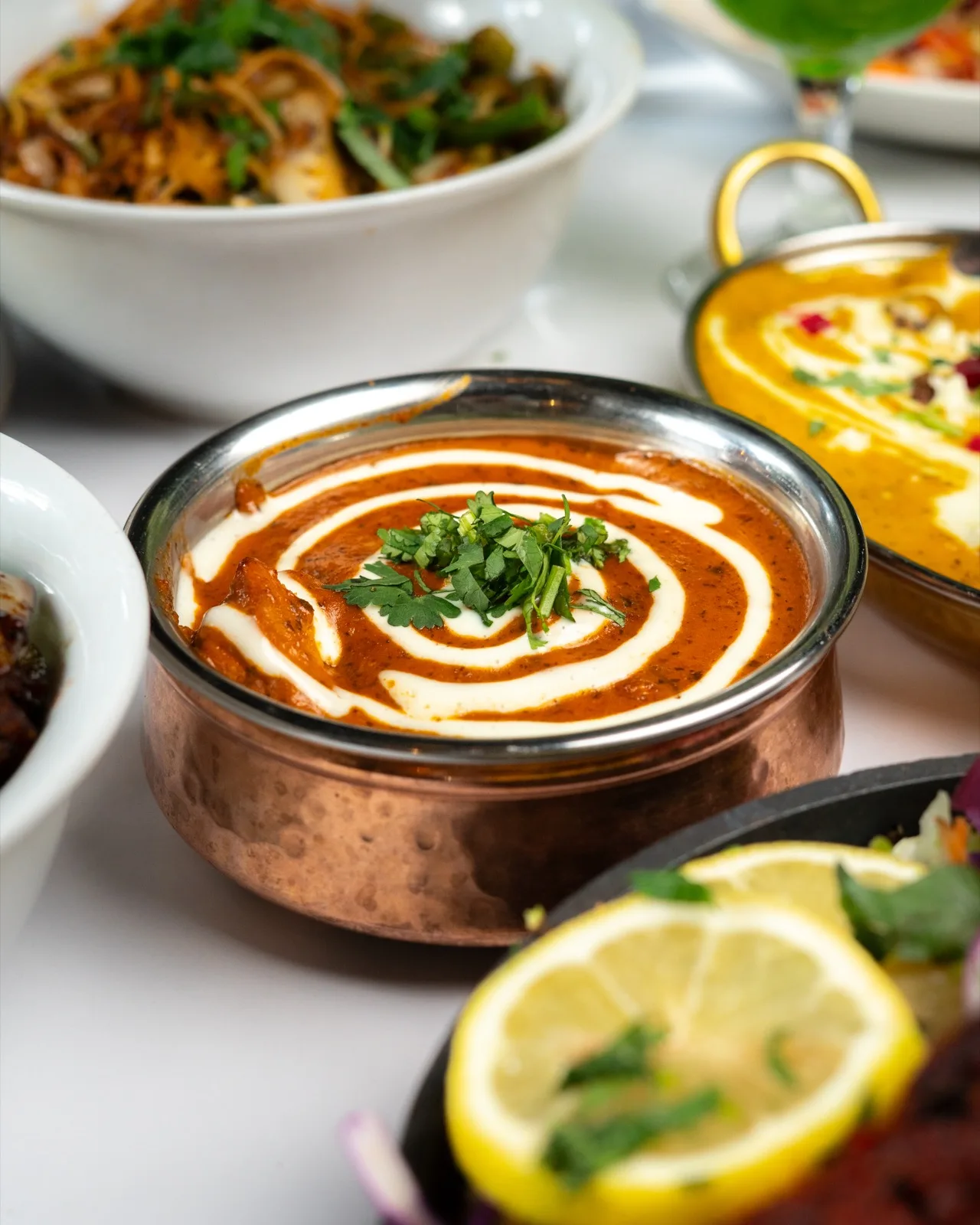 Butter chicken in a copper karahi